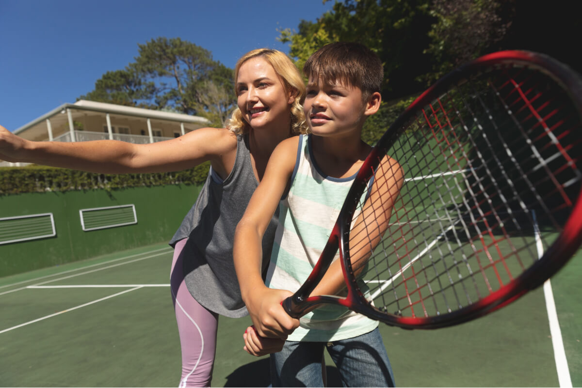 caucasian-mother-and-son-outdoors-playing-tennis-2022-02-07-22-22-35-utc (1)